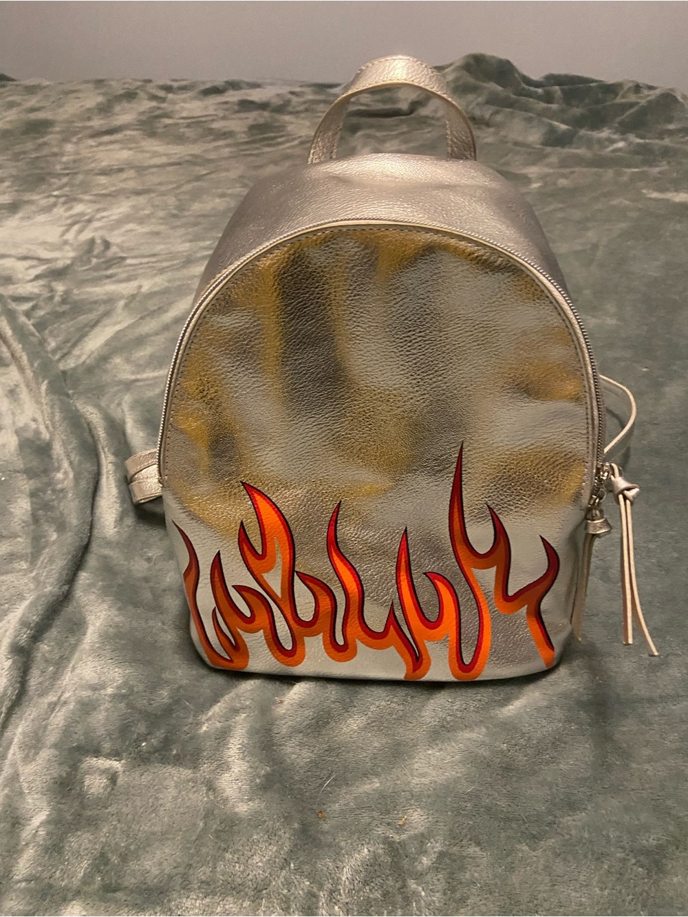 Metallic Silver Women's Backpack with Orange Flame Design